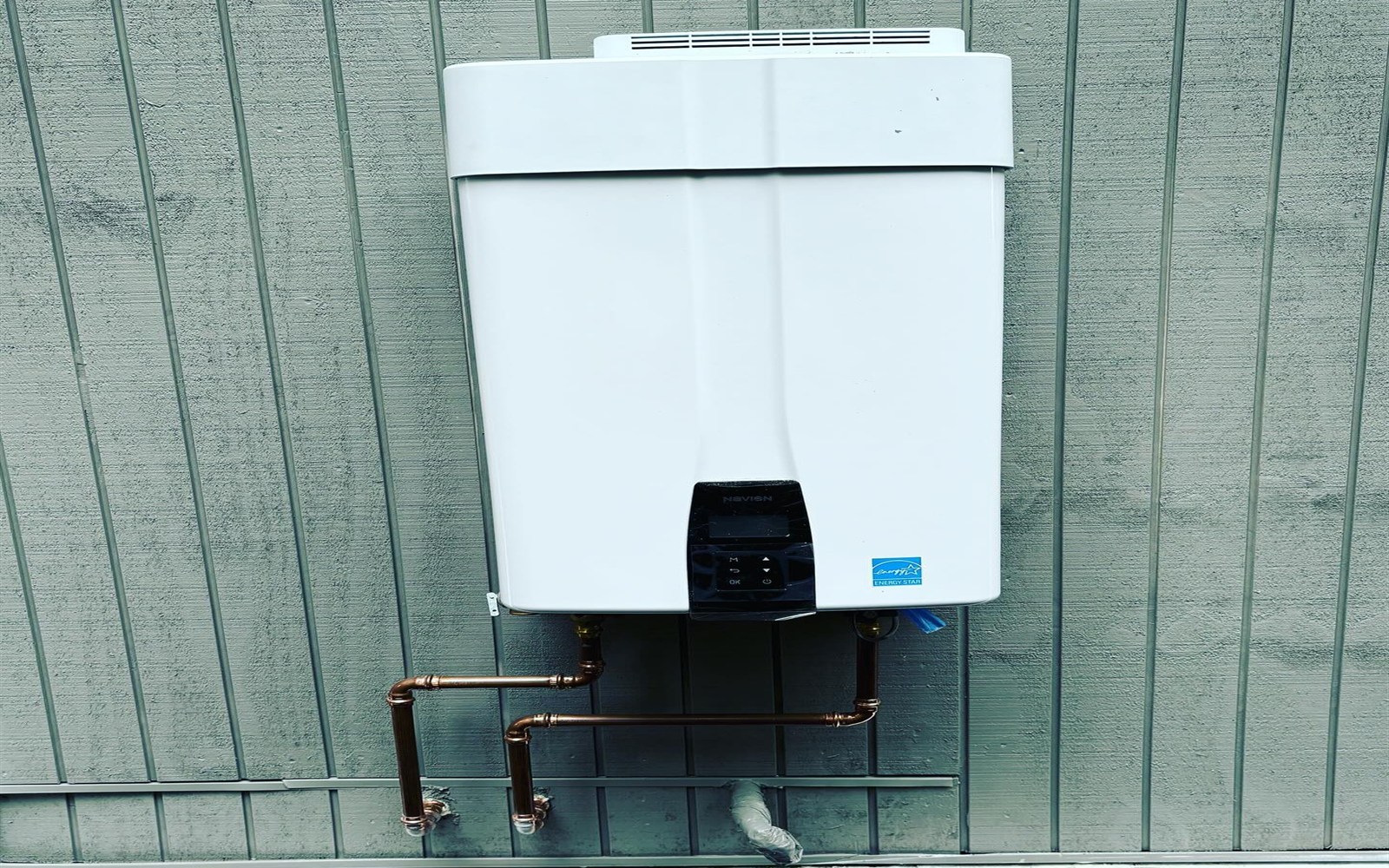 Exterior Navien tankless water heater installation