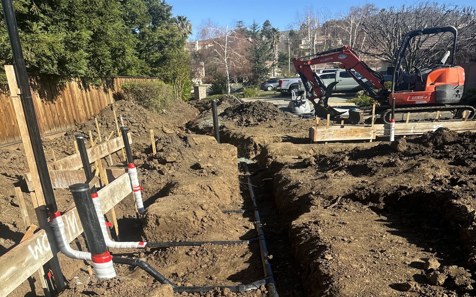 Underground sewer lateral trench and piping by Prime Time Plumbing