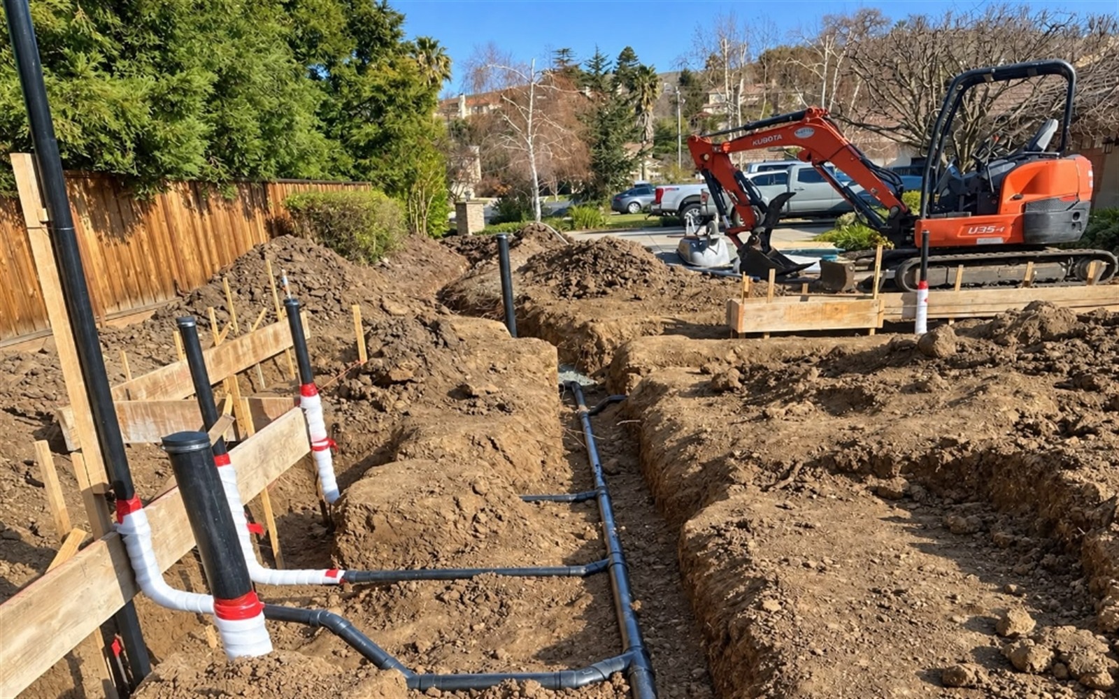 New construction underground ABS plumbing trench and risers by Prime Time Plumbing