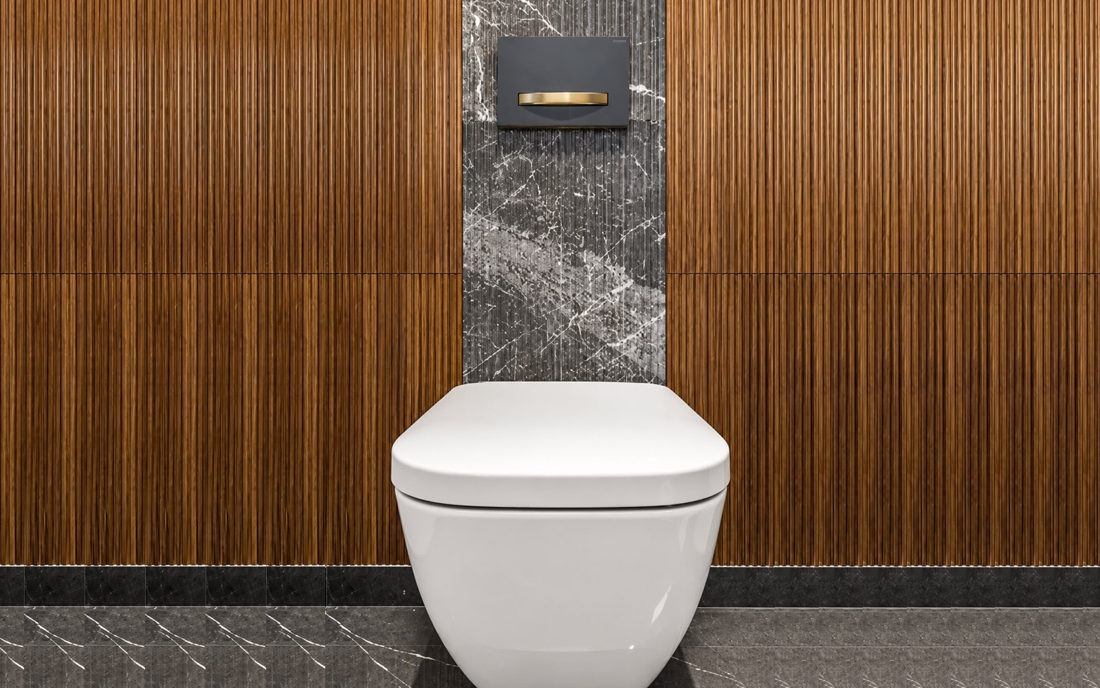 Finished luxury wall-hung toilet with concealed tank, gold flush plate, and fluted wood wall